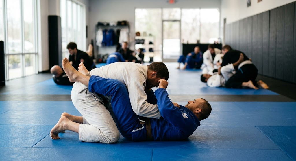 beginners practicing basic BJJ positions during grappling class